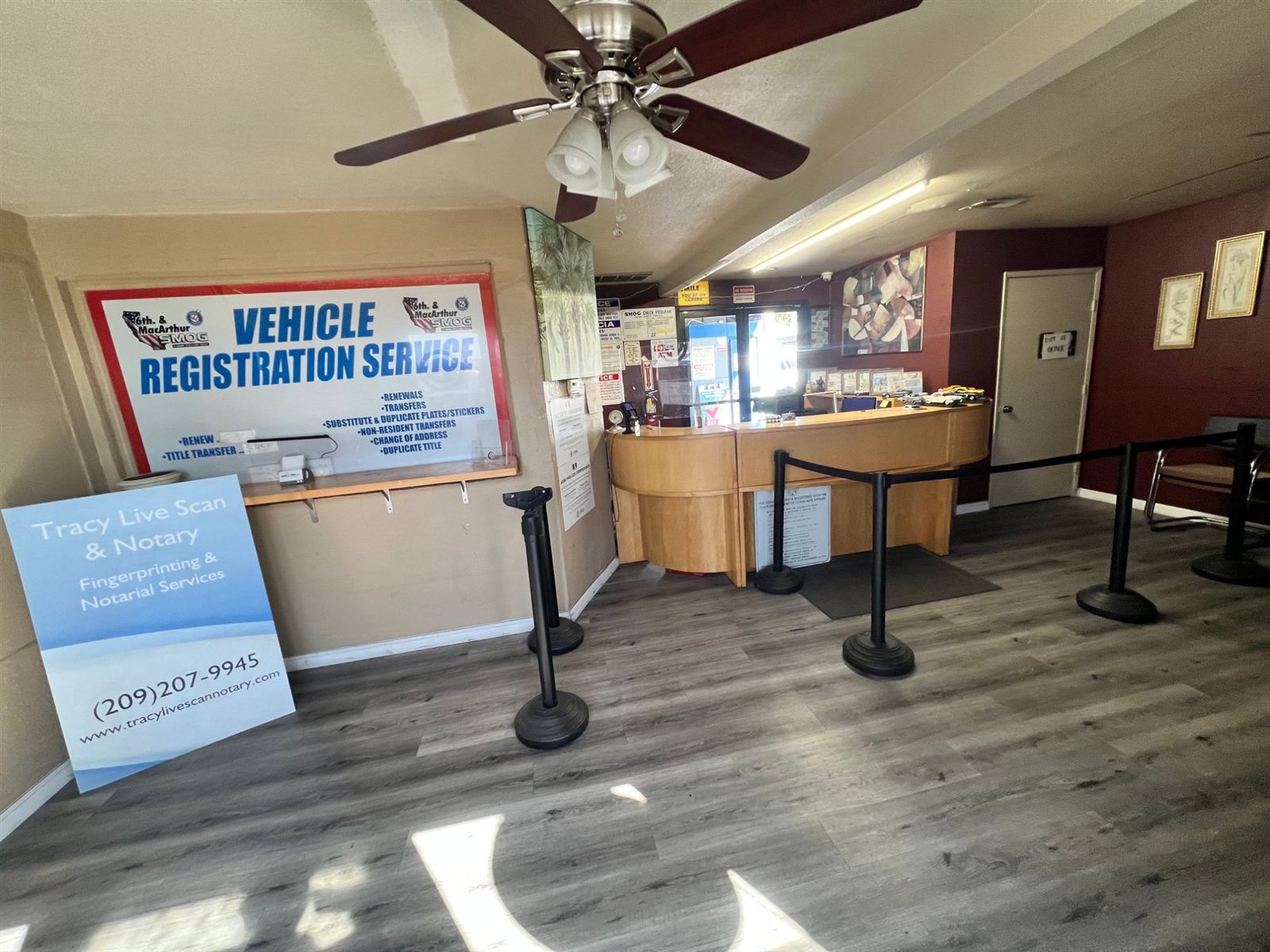 Customer service and vehicle registration counter inside the 6th St. & MacArthur Smog office in Tracy, CA